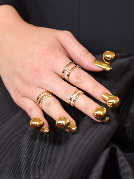 Audrey Nuna's gold nails
