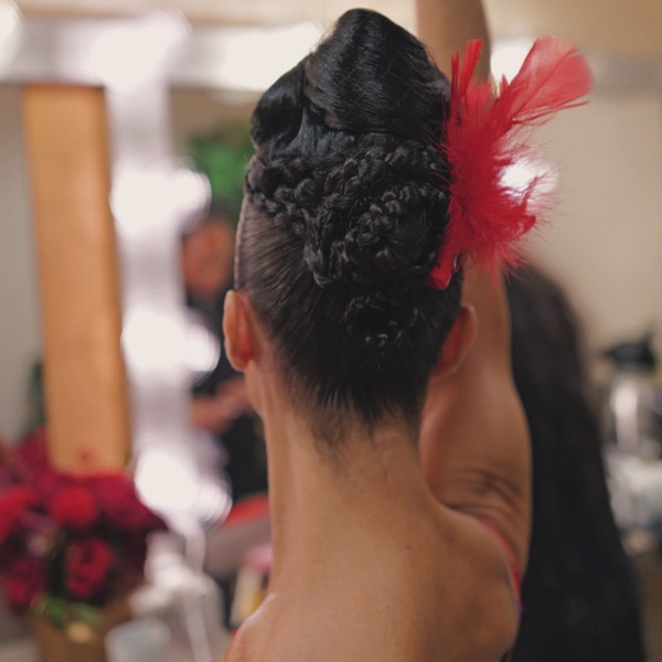 Ballerina Misty Copeland poses away from the camera showing off her intricately braided updo for her 2026 Oscars performance